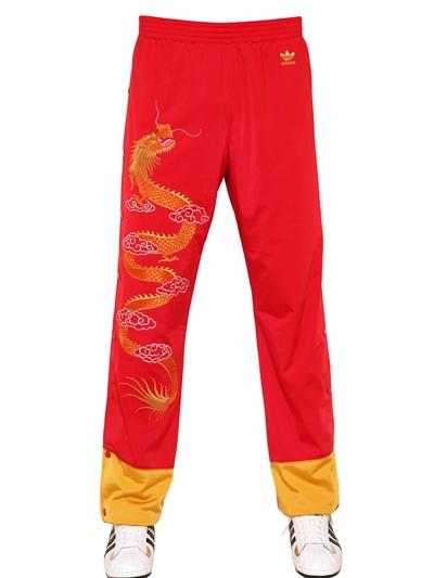 Foto adidas by jeremy scott dragon embroidered acetate jogging pants