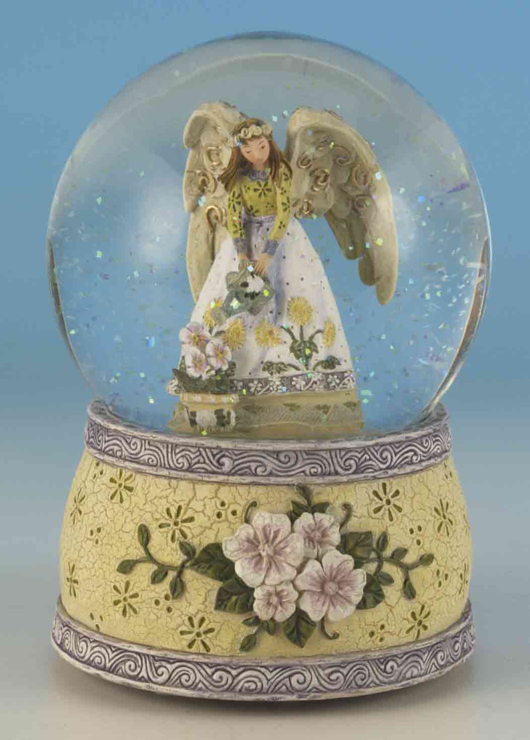 Foto Bola de cristal ángel con flores