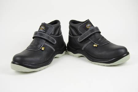 Foto bota de piel negra con velcro y piso de acero