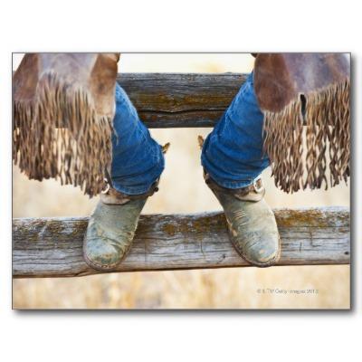 Foto Botas de vaquero en la cerca Postal