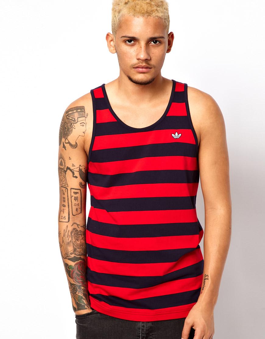 Foto Camiseta sin mangas con diseño a rayas llamativas de Adidas Origin...