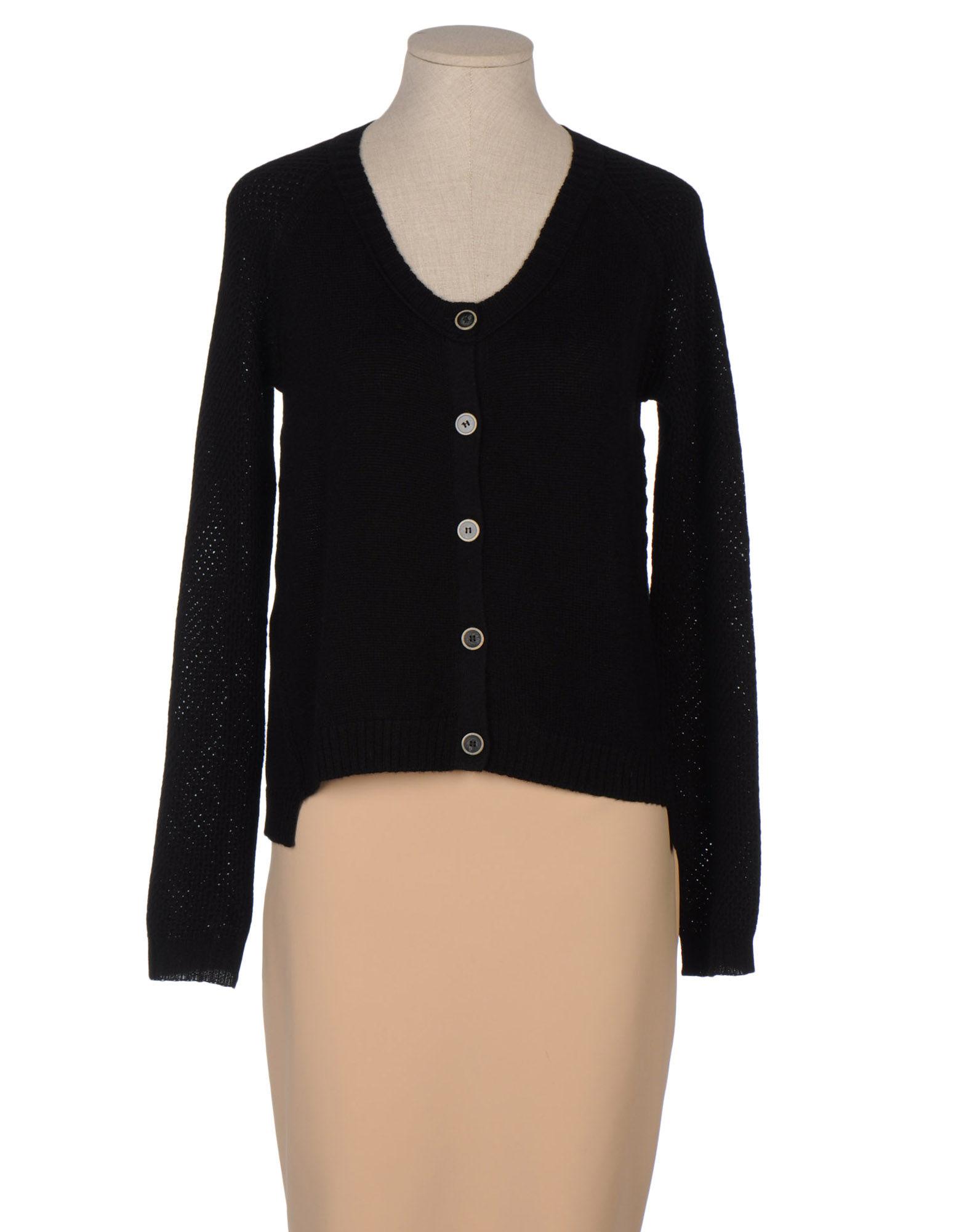 Foto chemins blancs cárdigans
