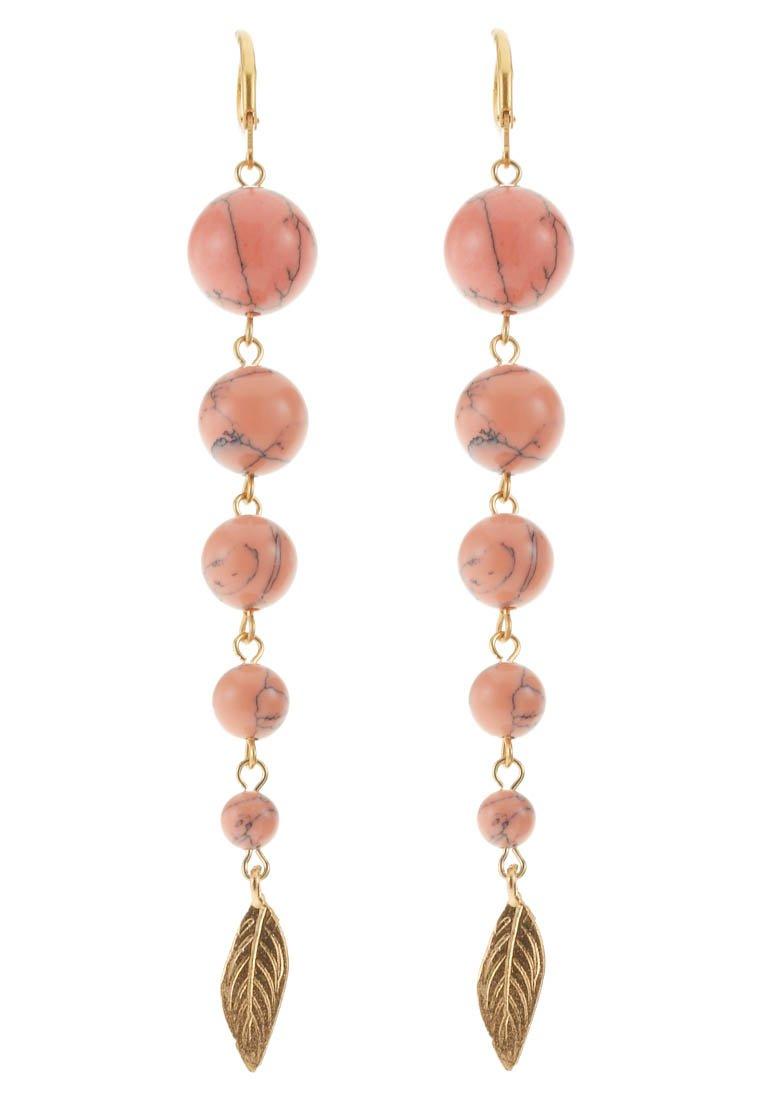 Foto David Aubrey Pendientes fucsia