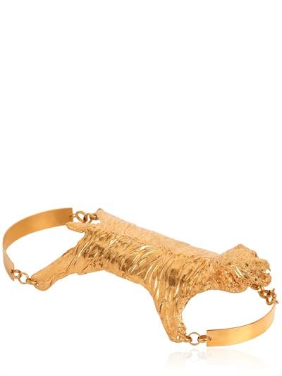 Foto dominique lucas pulsera de puño piel de tigre bañado en oro