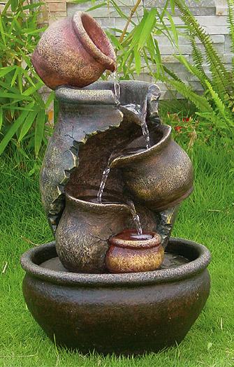 Foto Fuente Cascada con Jarrones de Aceite Craqueados