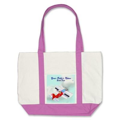 Foto La bolsa de asas del avión de la cigüeña del bebé