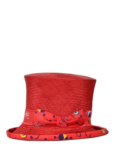 Foto manuel vanni sombrero alto de paja y moño de seda estampada