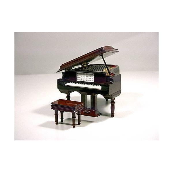 Foto Miniatura piano de cola con música.