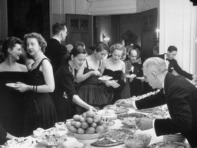 Foto Mrs. Henri Bonnet Trying the Buffet During Reception at French Embassy - Laminas
