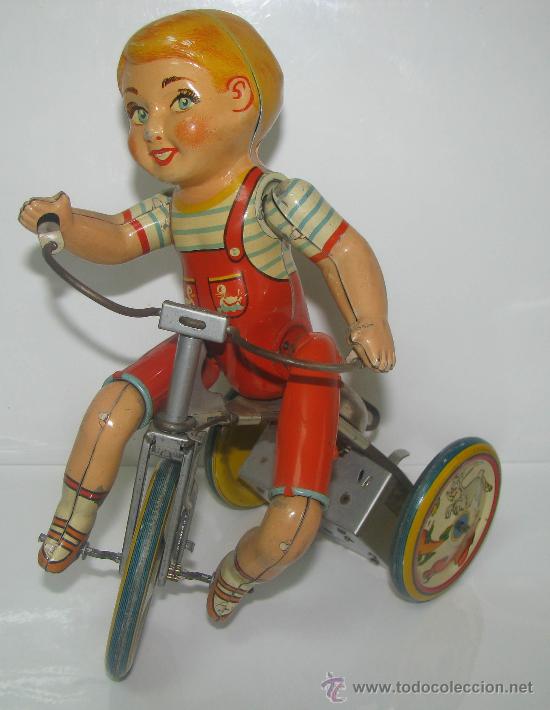 Foto niño kiddy en triciclo, hojalata litografiada y cuerda de unique