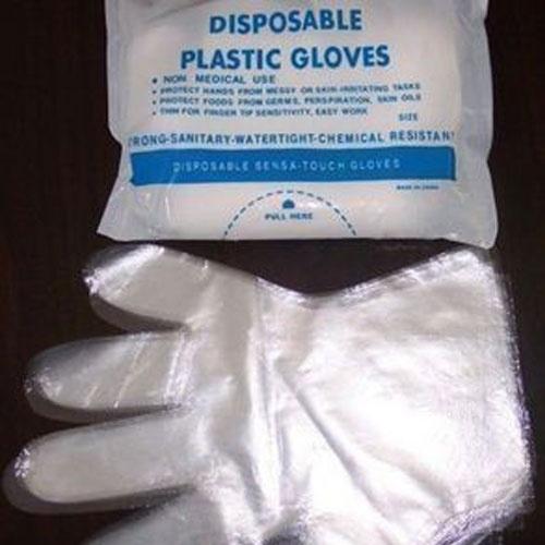 Foto pe guantes de un tiempo de película de plástico transparente sanita