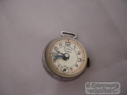 Foto Reloj de mujer huma. suiza. carga manual. colgante. maquinaria vista