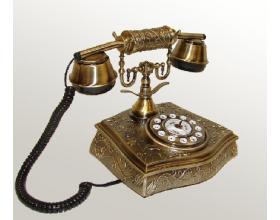 Foto telefono antiguo dorado