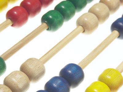 Foto Lámina fotográfica Colorful Wood Abacus Against White Background, 61x46 in. foto 682997
